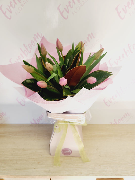 Bunch of Tulips in a waterfilled vase with greenery - Everbloom Floral Studio. Tauranga, Mount Maunganui and Papamoa florist