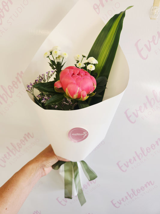 Single Stem Peonies wrapped in white paper and a bow. Everbloom floral studio your local Tauranga florist delivering fresh flowers same day across Papamoa, Mount Maunganui and Tauranga.
