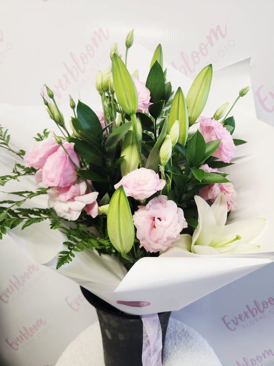 Flower bouquet of Pink Lisianthus and White Oriental Lilies with lush premium greenery. Everbloom Floral Studio