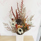 Our dried flower arrangements now come in white vases, Simply receive, display and enjoy, no fuss finding the right height vase for your flowers.  Dried arrangements may slightly vary due to availability and colour but for the most part will stay similar to the pictures provided.  A mix of strawflowers, caspea, spray roses, anenomes, lotus pods and wild flowers.  Same day flower delivery from our sunny mount maunganui floral studio.